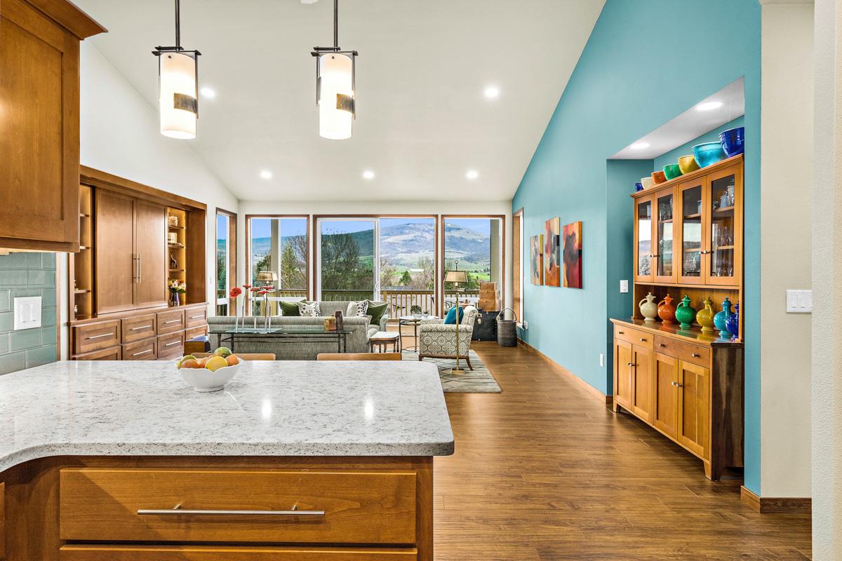 Photo of a kitchen and living room in a Rogue Valley Manor residence.