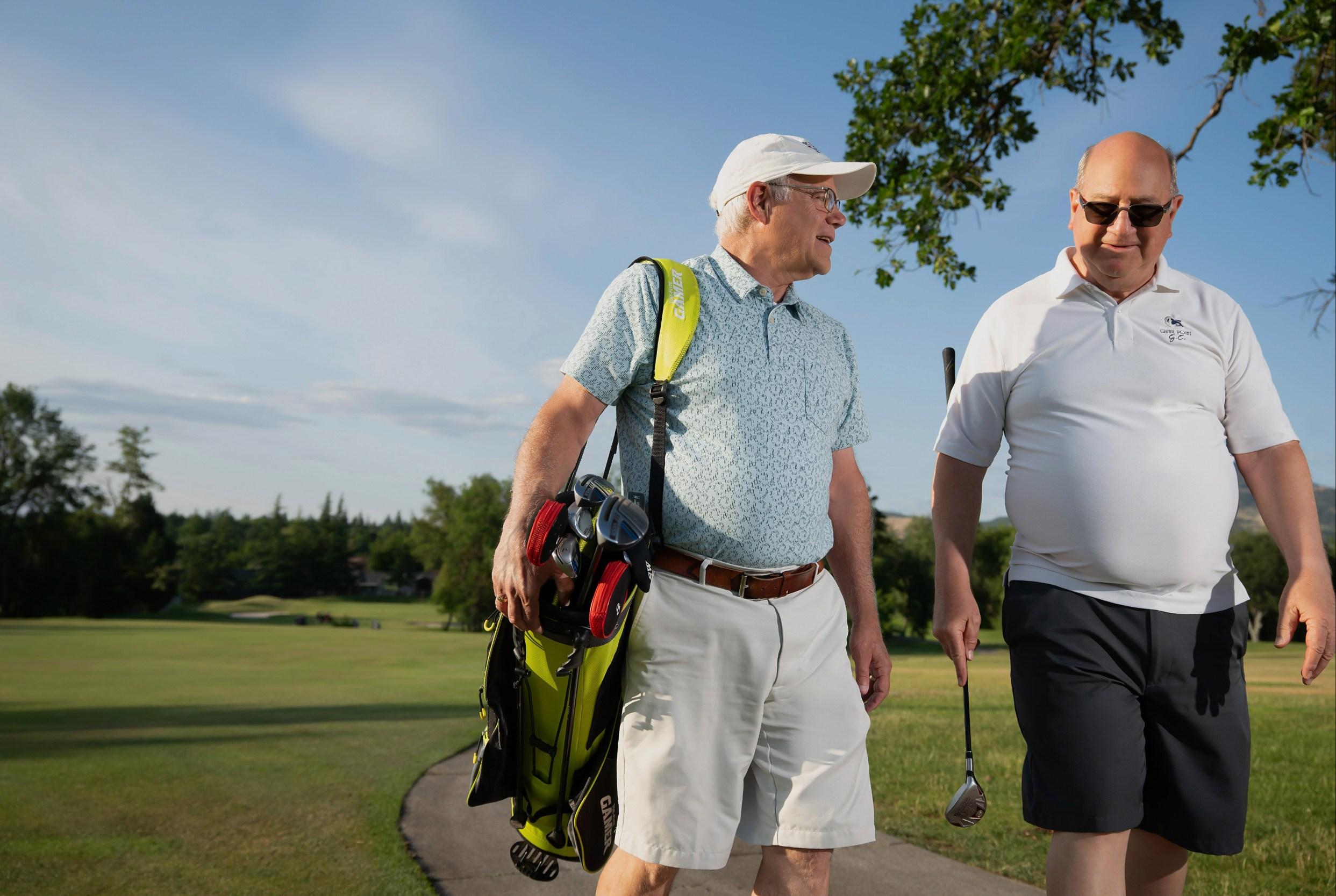 Two men on a golf course.