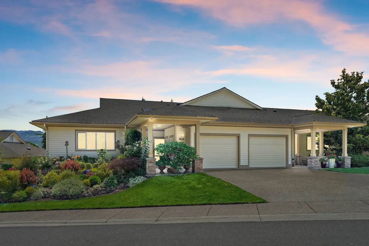 Exterior view of a Rogue Valley Manor cottage at dusk.
