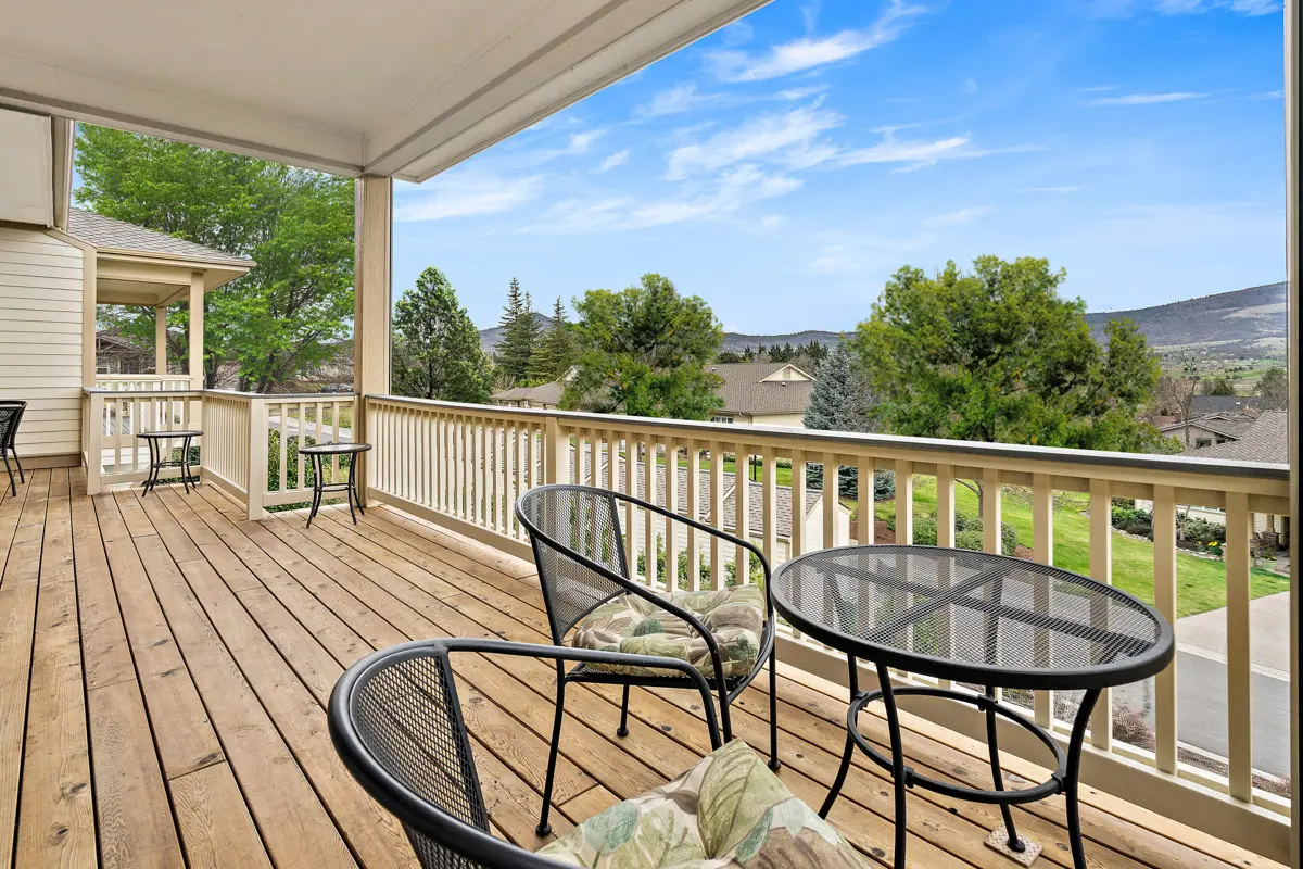 A spacious patio with several tables and chairs in a Rogue Valley Manor residence.