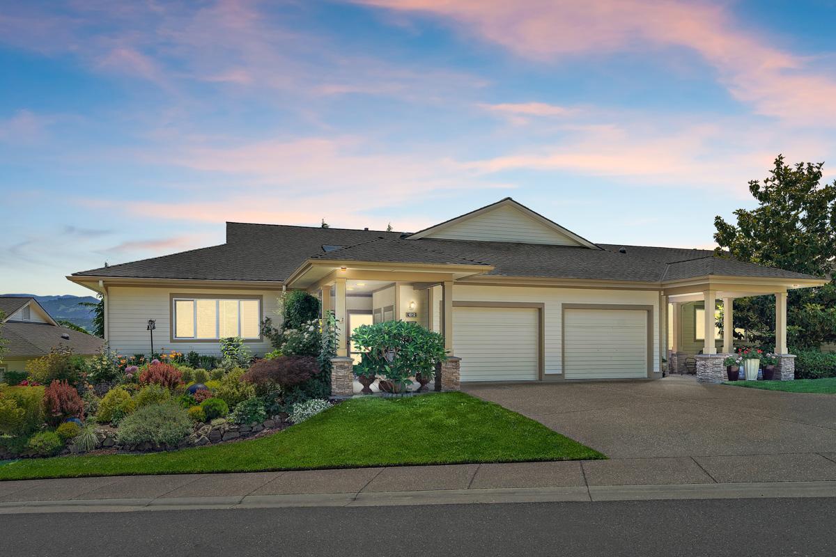 Exterior view of a Rogue Valley Manor residence at dusk.